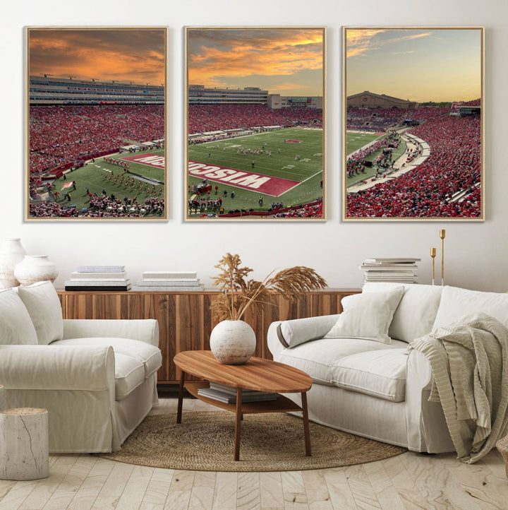 The wall features a Wisconsin Badgers wall art canvas print, capturing the vibrant atmosphere of a full Camp Randall Stadium at sunset.