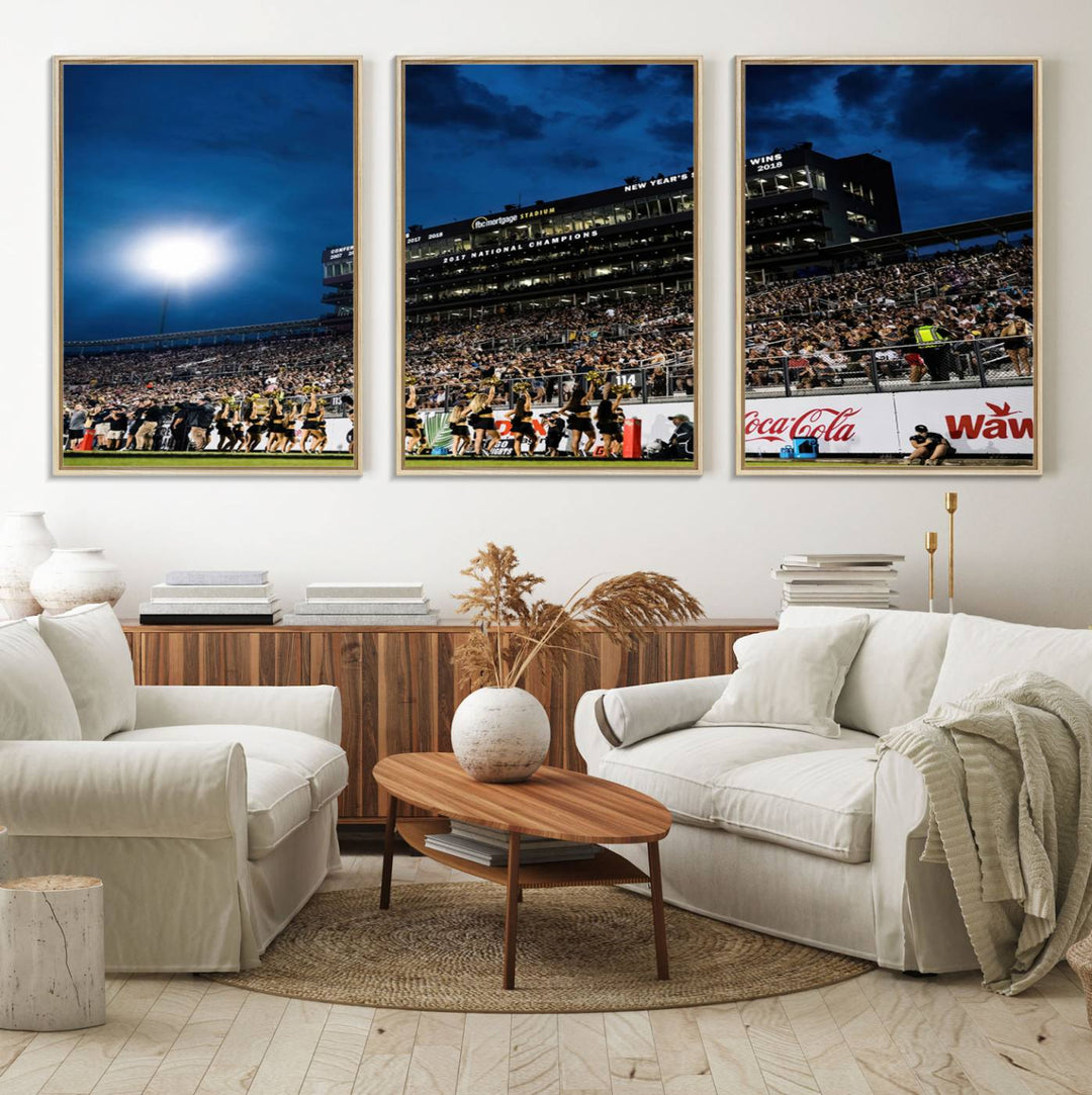 A gallery-quality canvas print depicting a stadium packed with fans under a night sky, highlighting the UCF Knights Football Team.