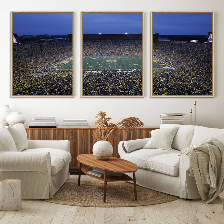 Wall art featuring an aerial shot of Michigan Stadium at dusk, showcasing the University of Michigan Wolverines M logo.