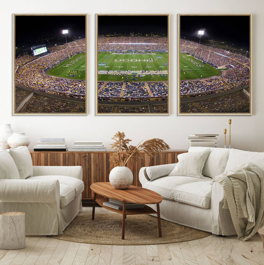 A large football stadium at night, featuring the UCONN Huskies, is depicted on the East Hartford Pratt & Whitney Stadium Wall Art Canvas Print.