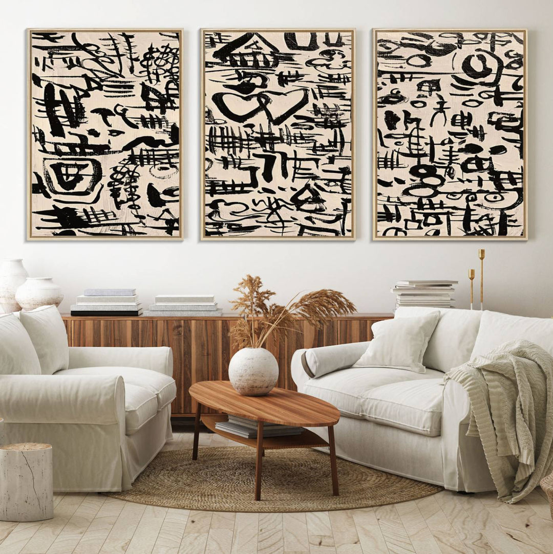 The Abstract Love and Chaos canvas is a museum-quality print featuring black symbols on a beige background, adorned with a heart and scribble design. It is framed to enhance its artistic appeal.