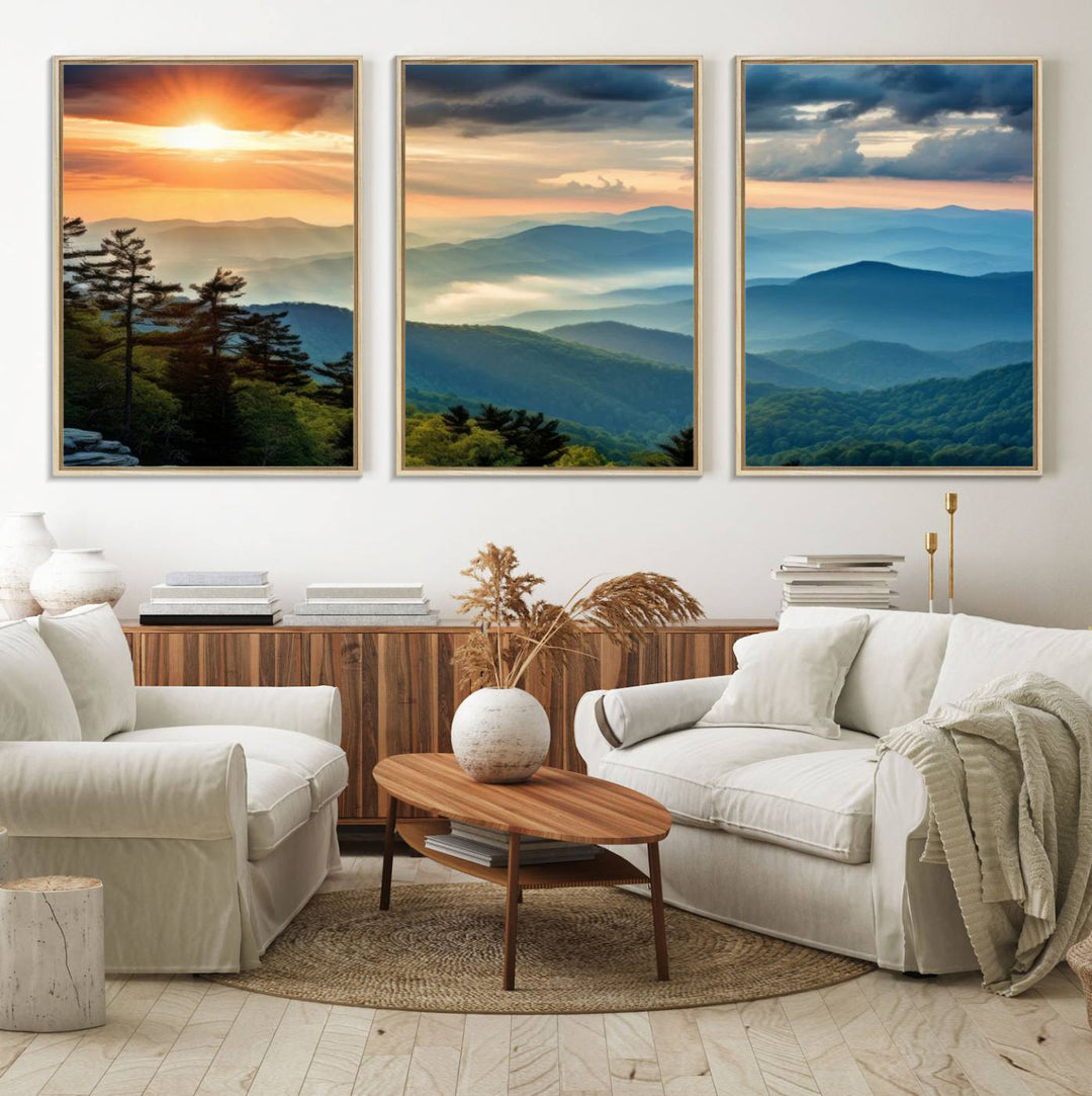 The wall art, titled Sunrise Over Mountain Range, is a canvas print that beautifully depicts layers of hills, scattered trees, and a partly cloudy sky.