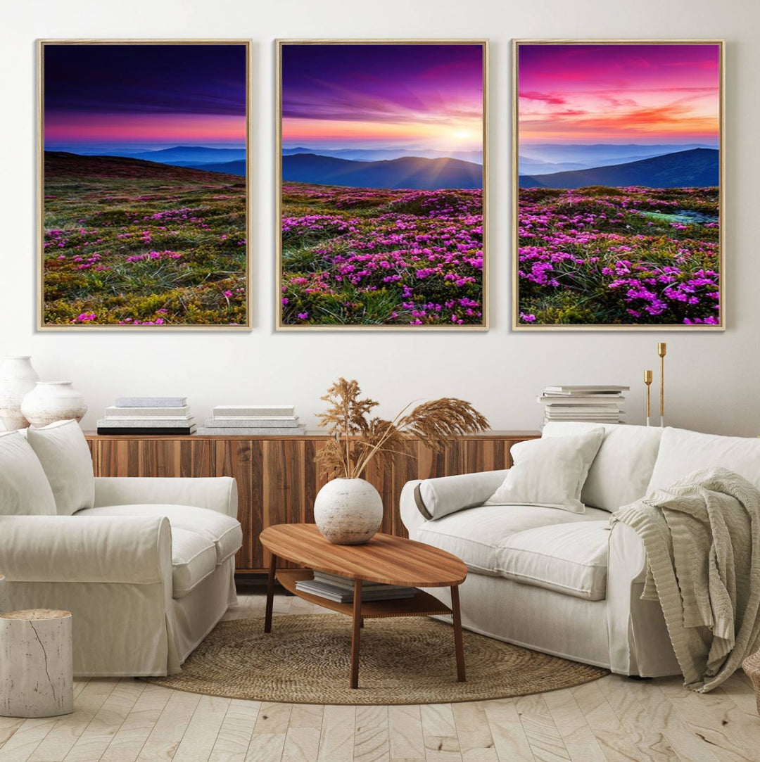 A 3-panel landscape photography canvas of a sunset over mountain meadows with purple wildflowers decorates the wall.