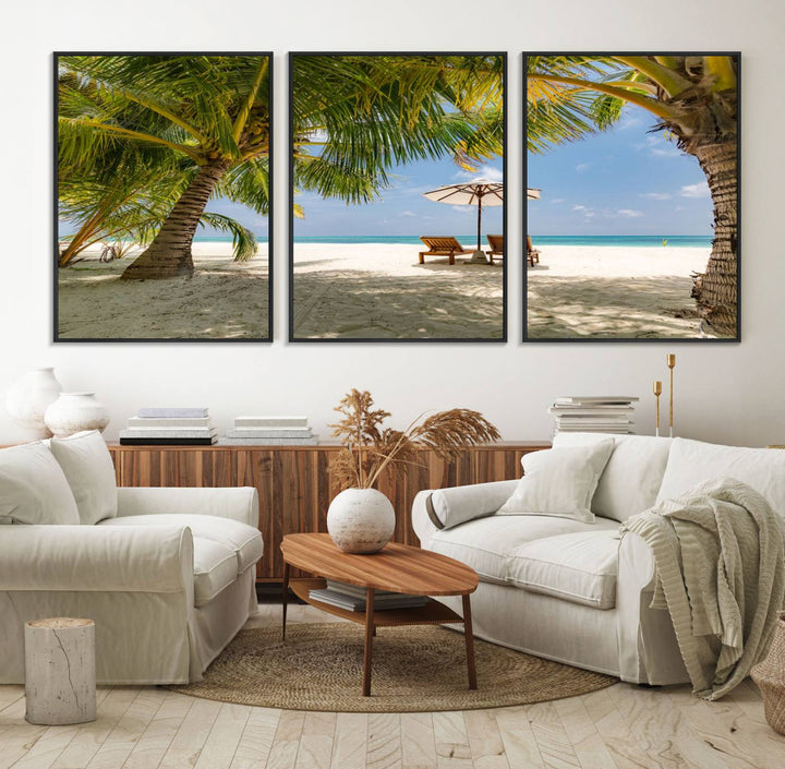 The canvas art print titled Lounge Chairs Palm Trees on Tropical Beach offers free shipping.