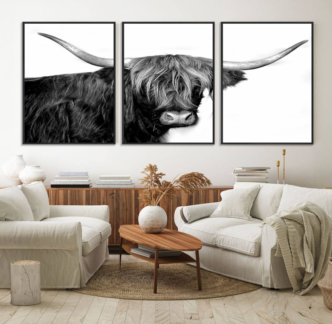 The Black and White Highland Cow Multi Panel Wall Art Canvas Print with UV-protection hangs prominently.