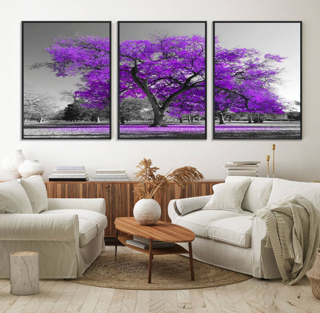 The Big Purple Tree Wall Art Canvas Print showcases a vibrant purple tree set against a black-and-white landscape.