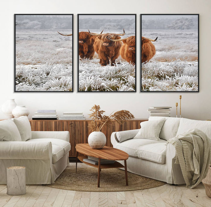 The Highland Cows in Snow canvas showcases three cattle in a frosty field.