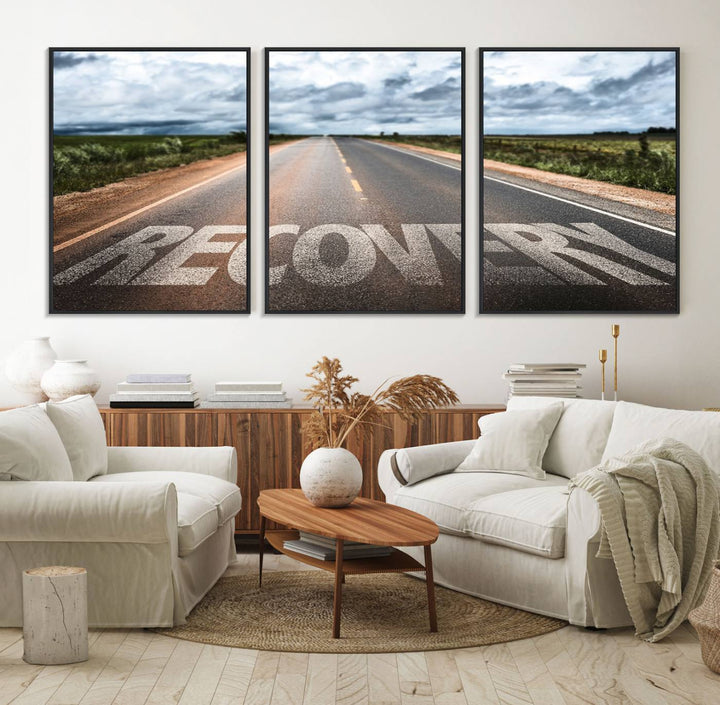 The Recovery Road Wall Art Canvas Print depicts a road under a cloudy horizon.