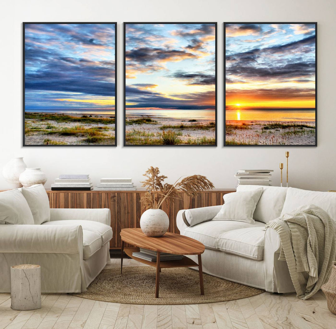 The Sunset On The Ocean canvas wall art features a beautiful beach sunset with grass and clouds.