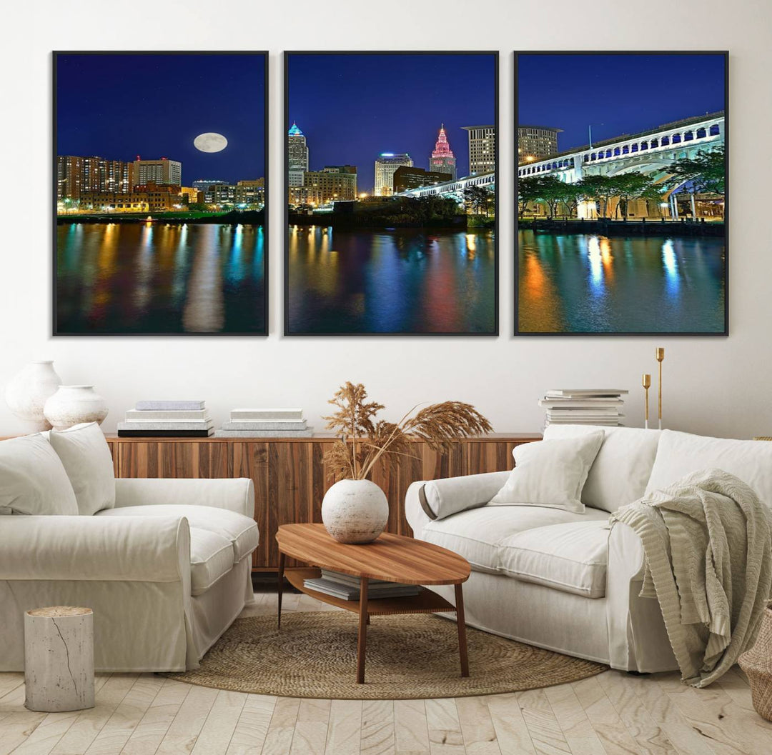 Cleveland City Lights Night Skyline Wall Art canvas showcases a moonlit cityscape reflected on water.