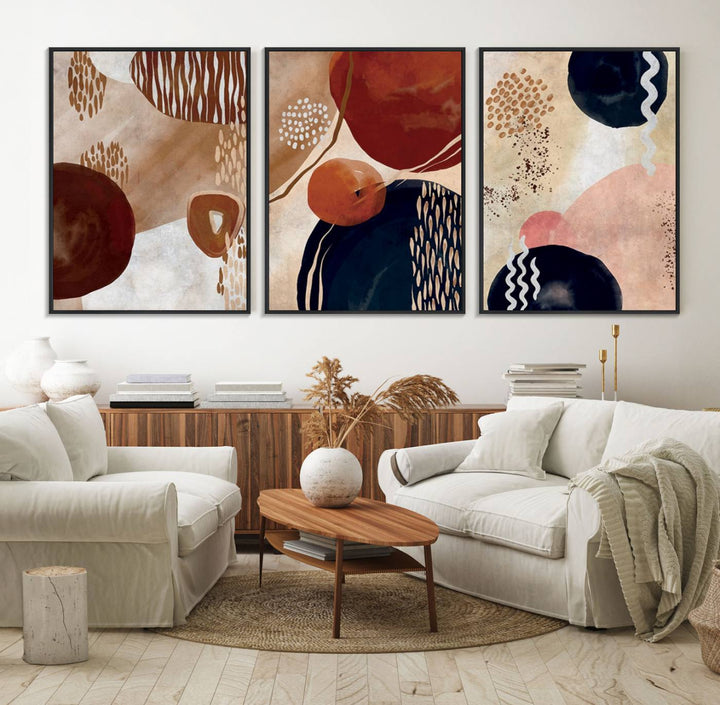 The Boho Neutral Canvas Print Set with earthy tones and circles hangs on the wall.