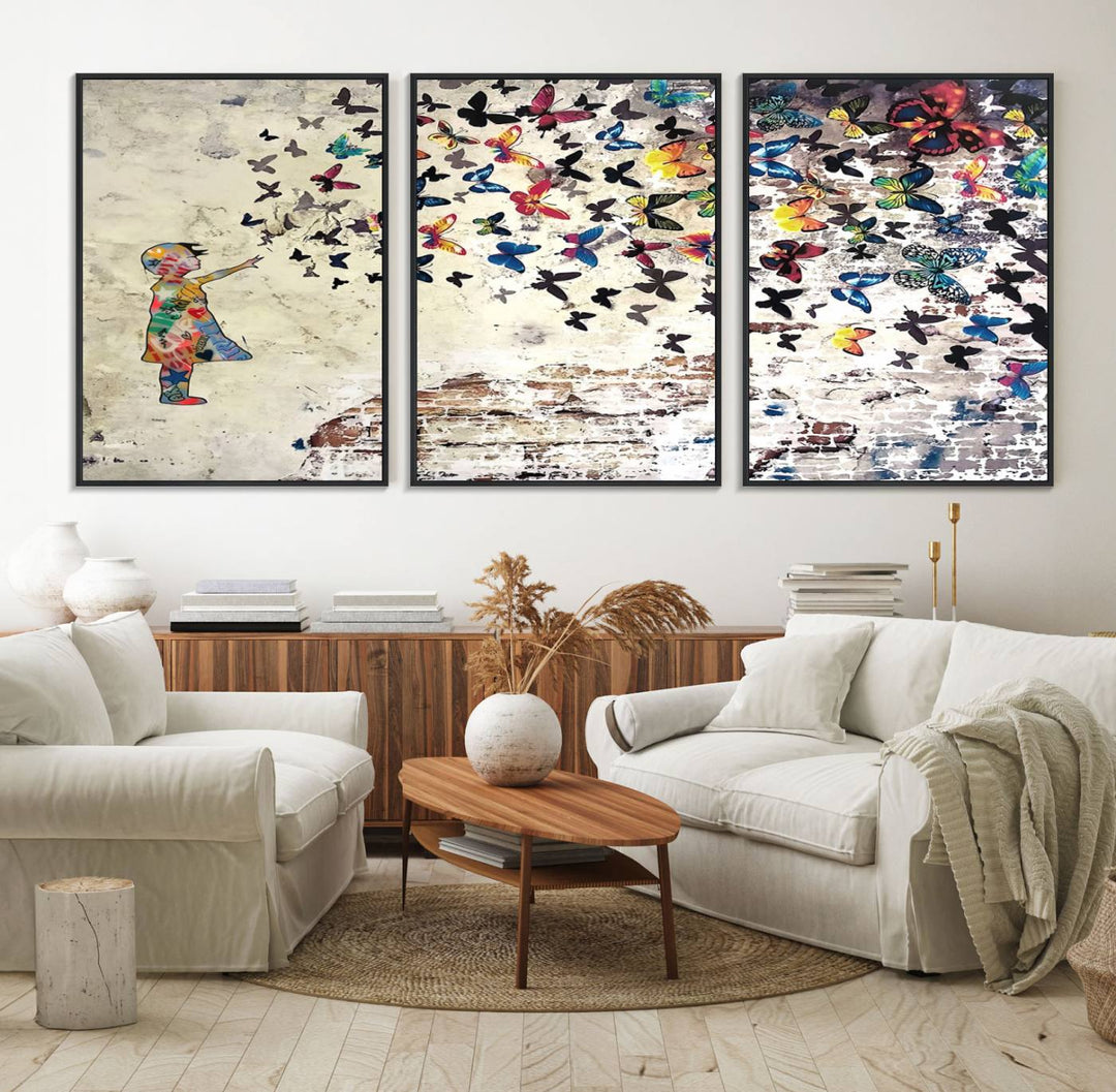 A Banksy Girl Butterfly Canvas Print is displayed on the textured wall.