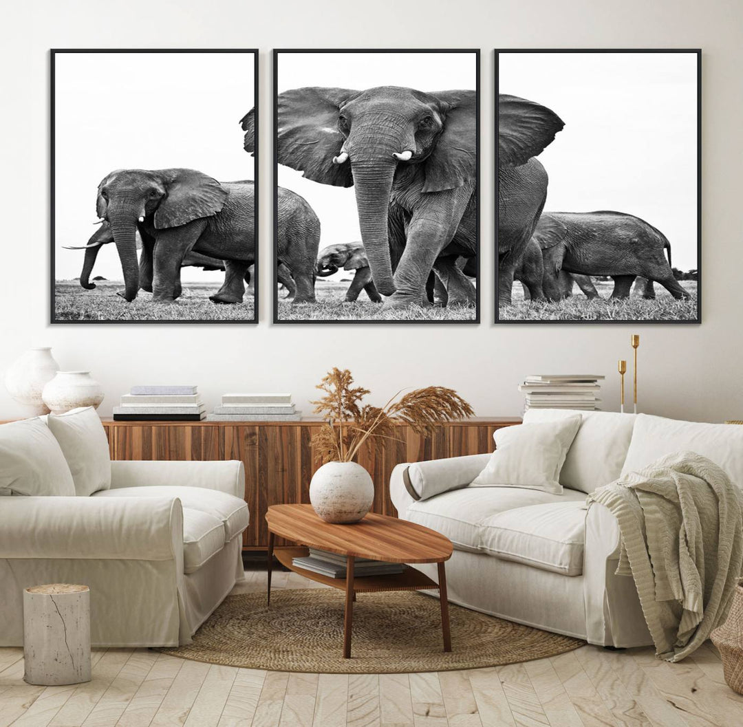 A modern dining area features a Black White Elephant Family Wall Art Canvas Print.