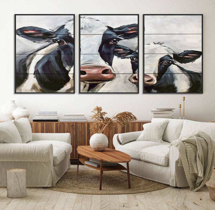 The Vintage Baby and Mom Cattle Canvas, featuring cows with black and white patches, is a prominent piece of wall art.