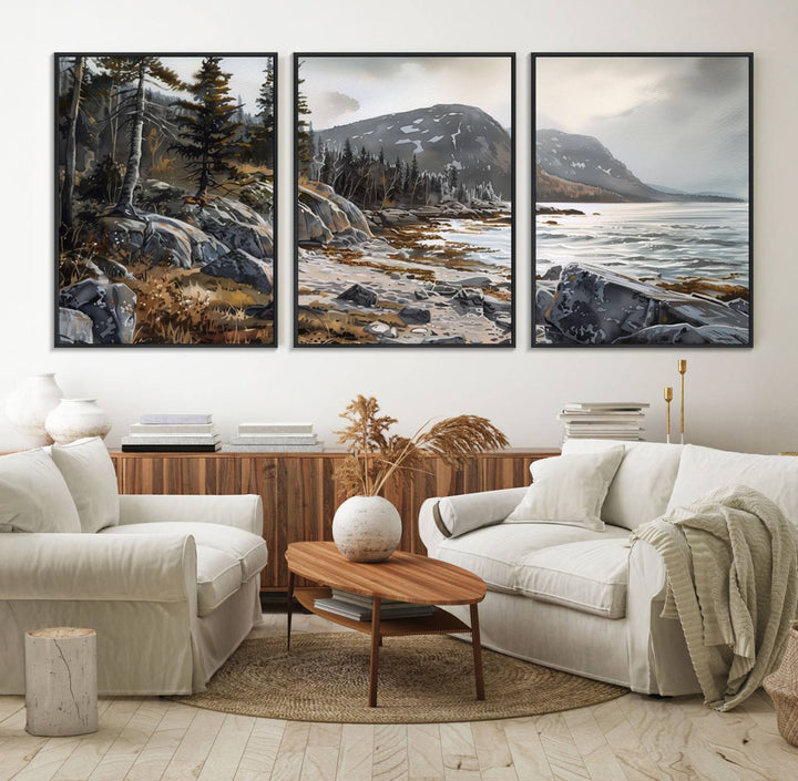 Framed wall art depicting Acadia National Parks rocky coast, trees, mountains, and sunlight over the sea; ready to hang.