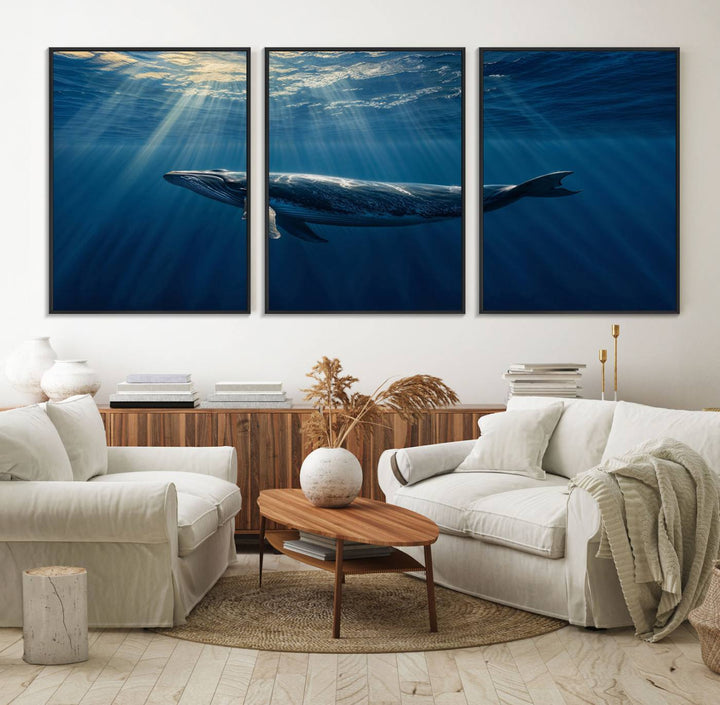 The Whale under Ocean wall art canvas print graces the white wall.