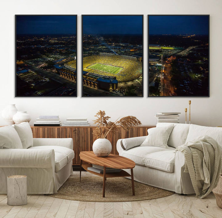 Aerial view of Michigan Stadium at night, surrounded by city lights, depicted on a Michigan Wolverines wall art canvas print.