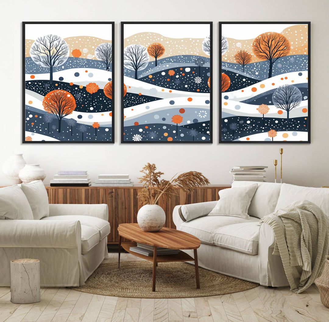 The "Abstract Winter Landscape Canvas Wall Art Print," featuring a triptych of landscapes with trees and hills in vibrant orange, white, and blue hues, adds a gallery-quality finish that transforms the space into an art lover's dream.