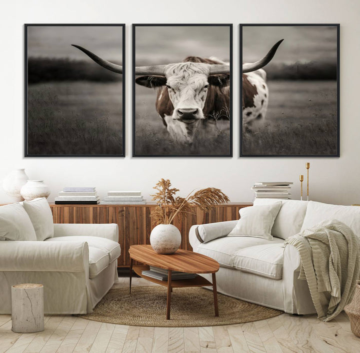 The Texas Longhorn Cow Canvas Wall Art Print adds a rustic touch to a living room.