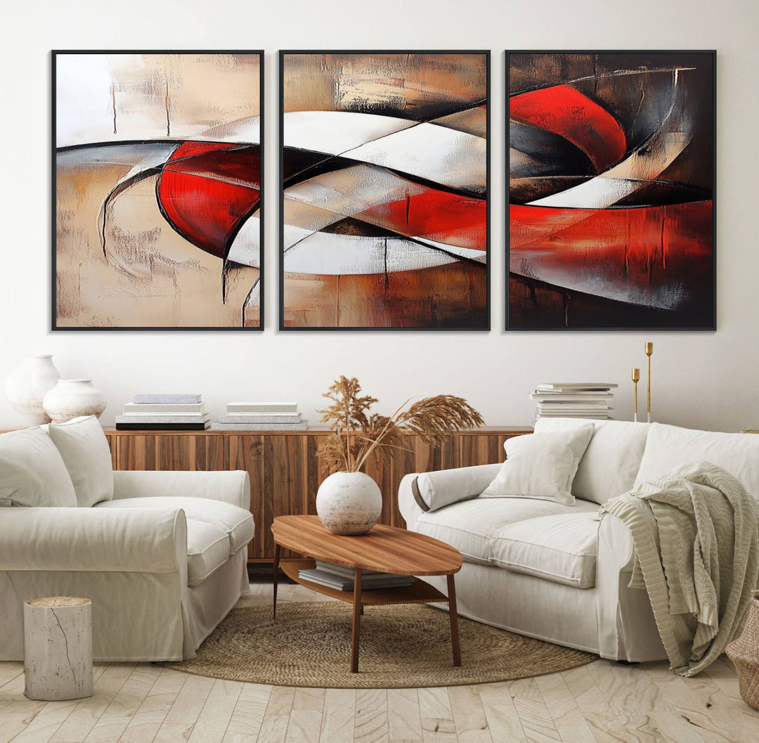 The "Abstract Wall Art - Modern Red and White Canvas Wall Art Print" features bold geometric shapes in red, black, and white on a beige background, enhancing contemporary aesthetics. This canvas print adds a striking focal point to any room, beautifully complementing the modern vibe of the space.