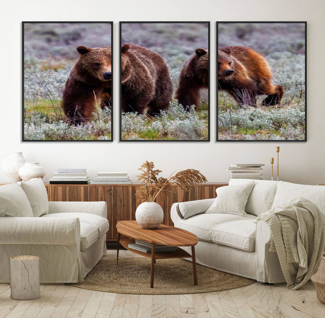 The "Queen of the Tetons" is a stunning canvas art print featuring Grizzly 399 and two bears strolling through a grassy field. Its gallery-quality finish beautifully captures the essence of nature, making it perfect for rustic home decor.