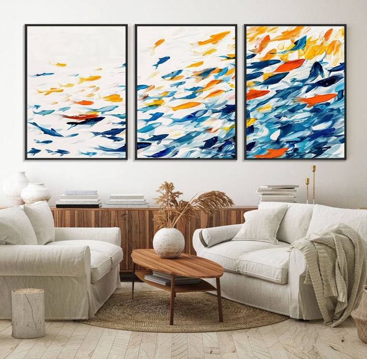 A colorful Abstract Fish Shoal Canvas Print hangs on the wall.