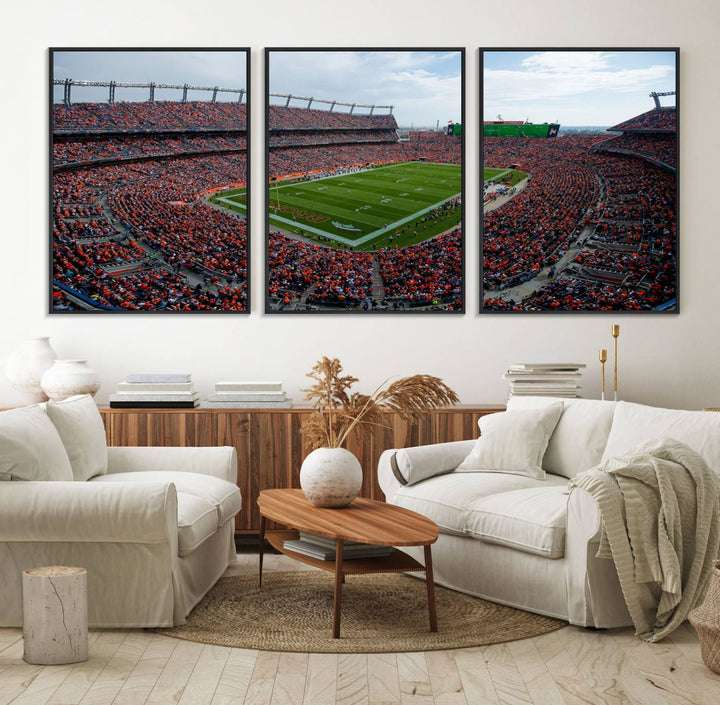 The Denver Broncos Football Print features a vibrant, fan-filled orange stadium overlooking the football field.