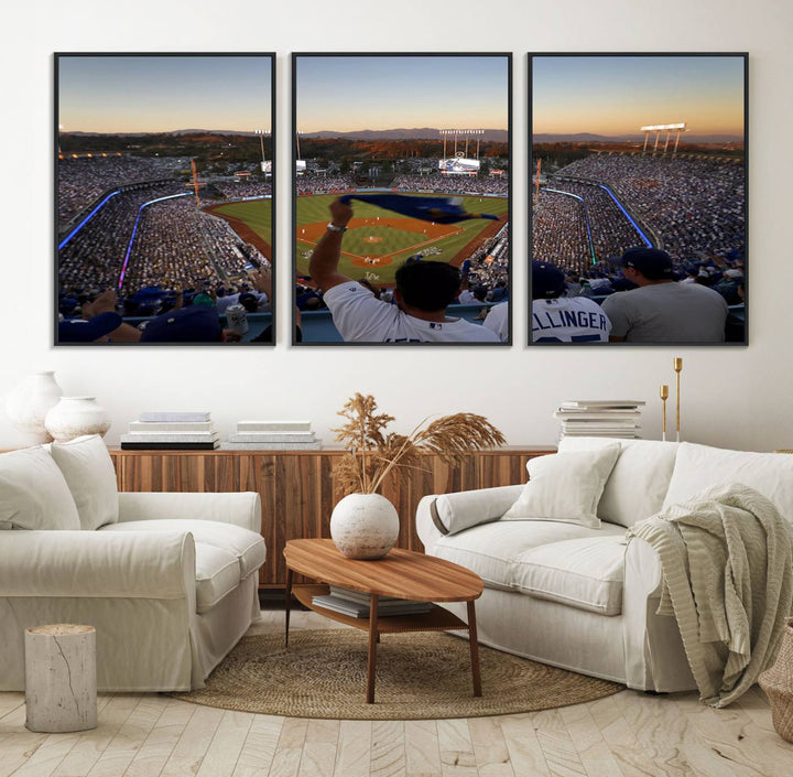 A triple canvas wall art captures the scene at Dodger Stadium, with fans cheering as the sun sets and a flag waving on the field.