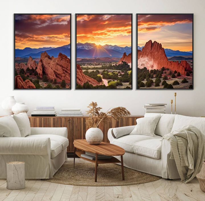 A vibrant sunset over the Rocky Mountains with red rocks.