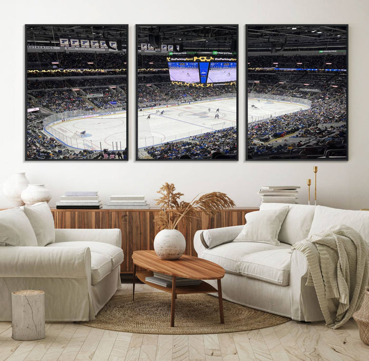 A large Enterprise Center canvas of a crowded hockey arena hangs prominently.