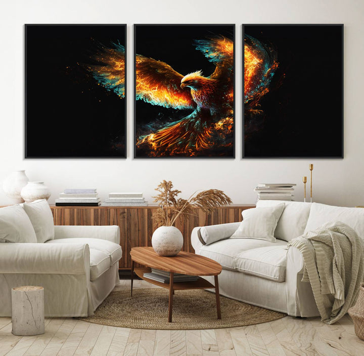 The Fiery Phoenix Canvas Print, showcasing a majestic bird with fiery wings against a black background, makes for the perfect bold decor in your living room.