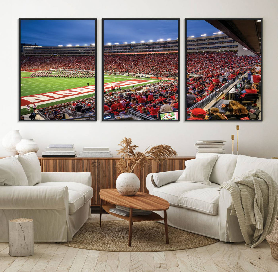 A vibrant wall art captures the essence of Madison Camp Randall Stadium, depicting a sea of fans in red and white during a Wisconsin Badgers football game under bright lights.