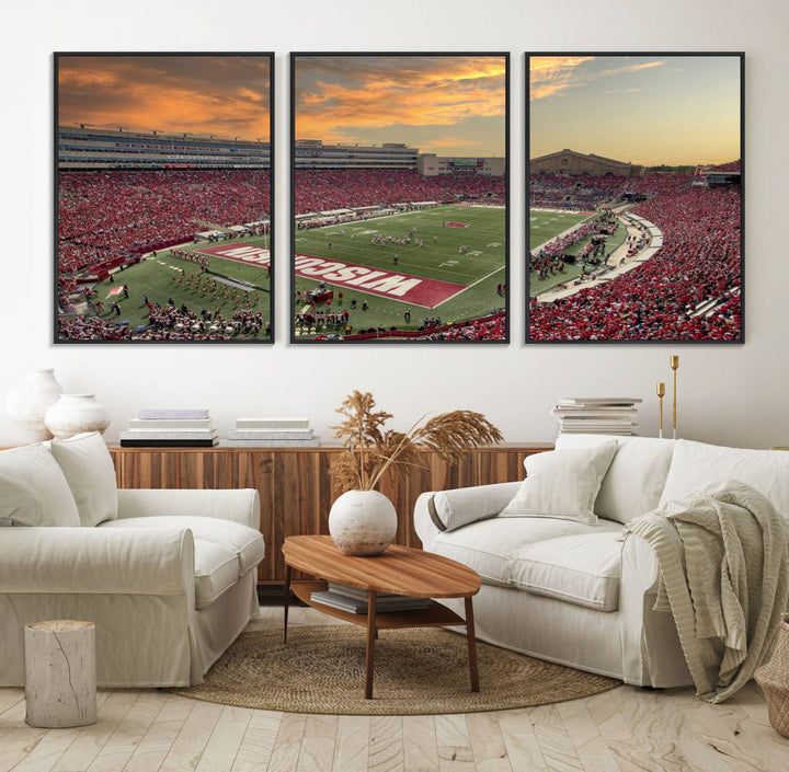 The wall features a Wisconsin Badgers wall art canvas print, capturing the vibrant atmosphere of a full Camp Randall Stadium at sunset.