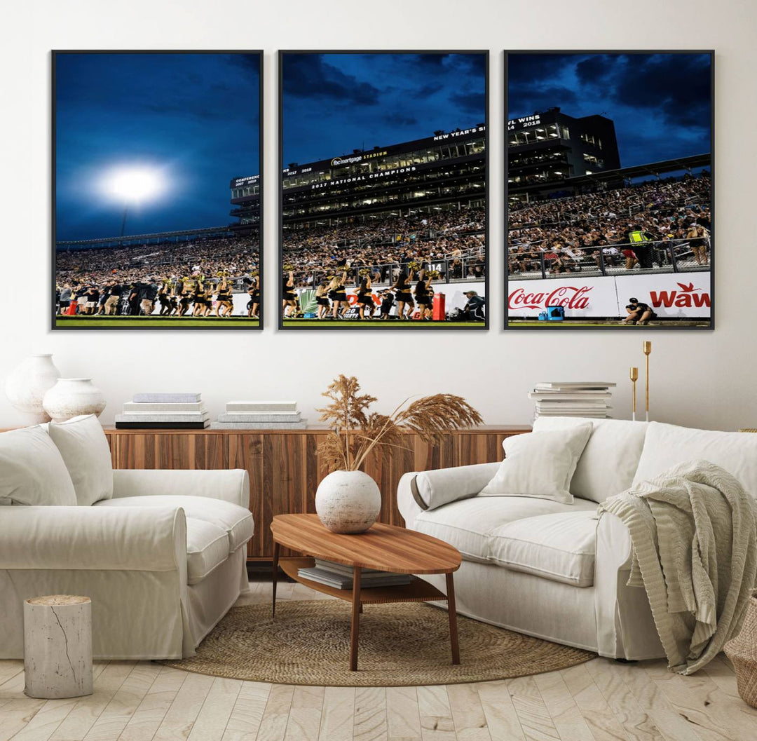 A gallery-quality canvas print depicting a stadium packed with fans under a night sky, highlighting the UCF Knights Football Team.