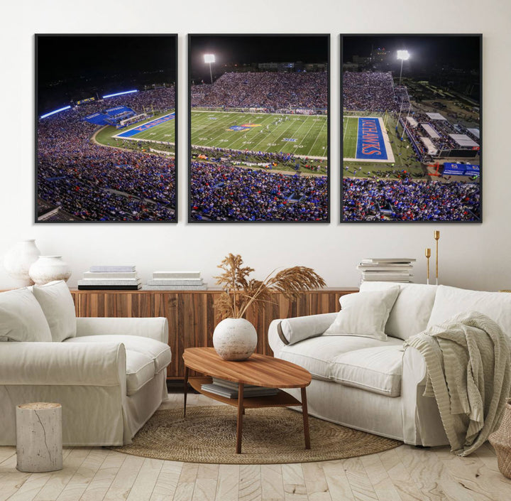 A canvas depicting an aerial view of the University of Kansas Memorial Stadium, showcasing bright lights and a lush green field at night.