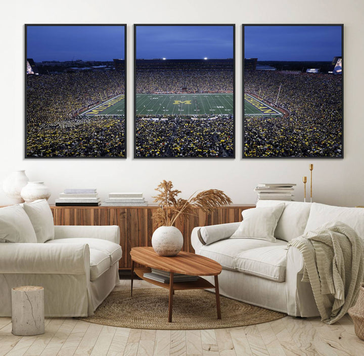 Wall art featuring an aerial shot of Michigan Stadium at dusk, showcasing the University of Michigan Wolverines M logo.