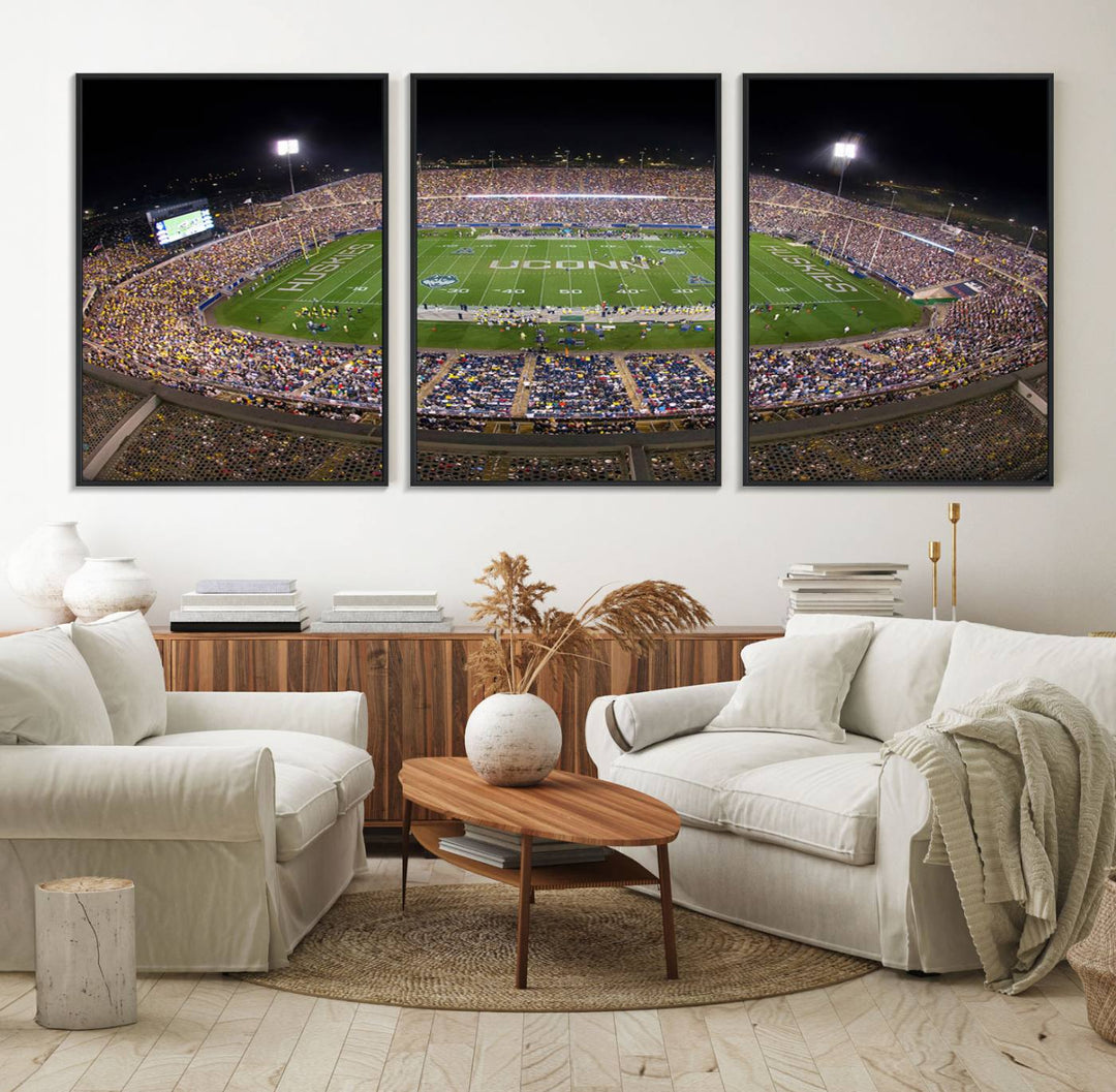 A large football stadium at night, featuring the UCONN Huskies, is depicted on the East Hartford Pratt & Whitney Stadium Wall Art Canvas Print.