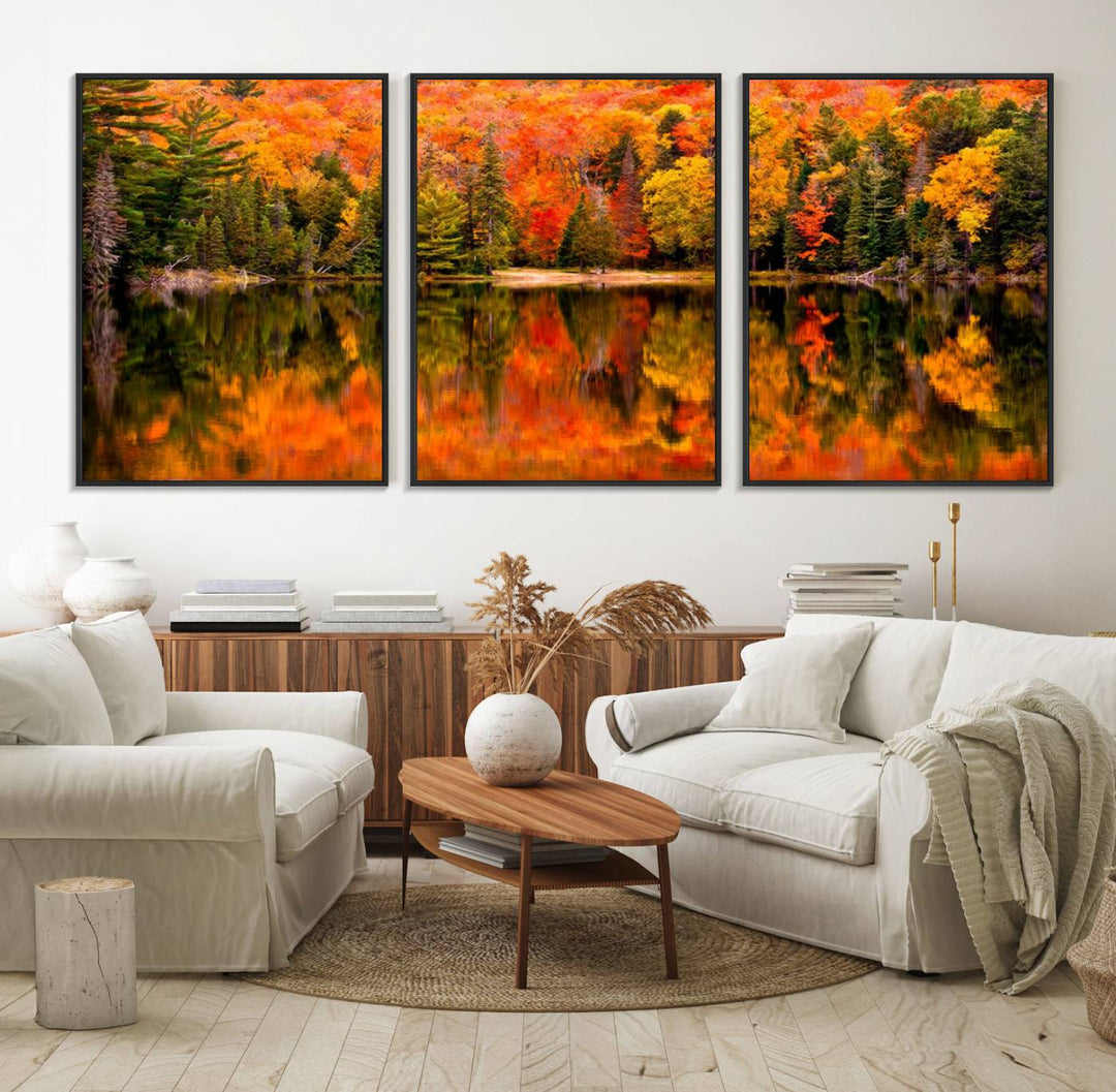 Autumn Forest Reflection Wall Art: a vibrant triptych canvas featuring fall foliage with red, orange, and yellow leaves over a calm lake.