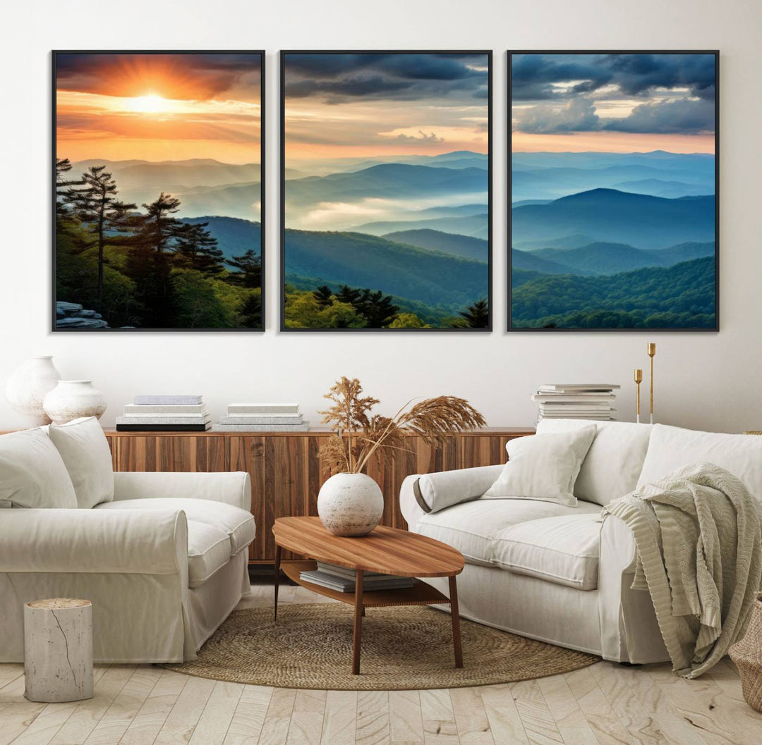 The wall art, titled Sunrise Over Mountain Range, is a canvas print that beautifully depicts layers of hills, scattered trees, and a partly cloudy sky.