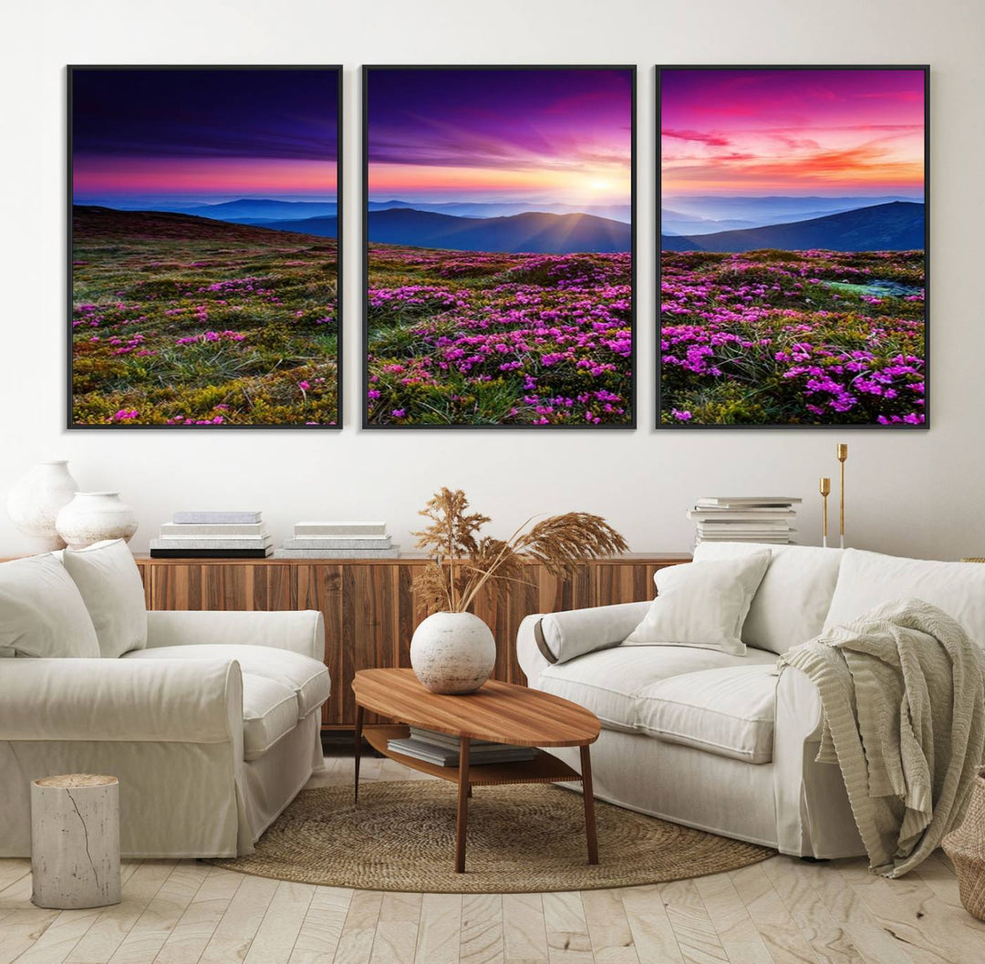 A 3-panel landscape photography canvas of a sunset over mountain meadows with purple wildflowers decorates the wall.