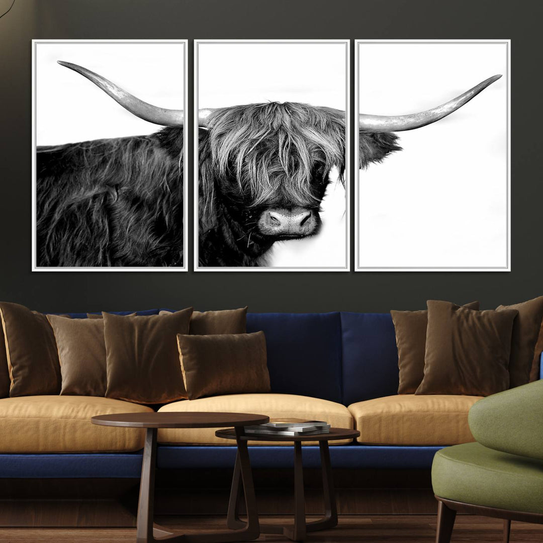 The Black and White Highland Cow Multi Panel Wall Art Canvas Print with UV-protection hangs prominently.