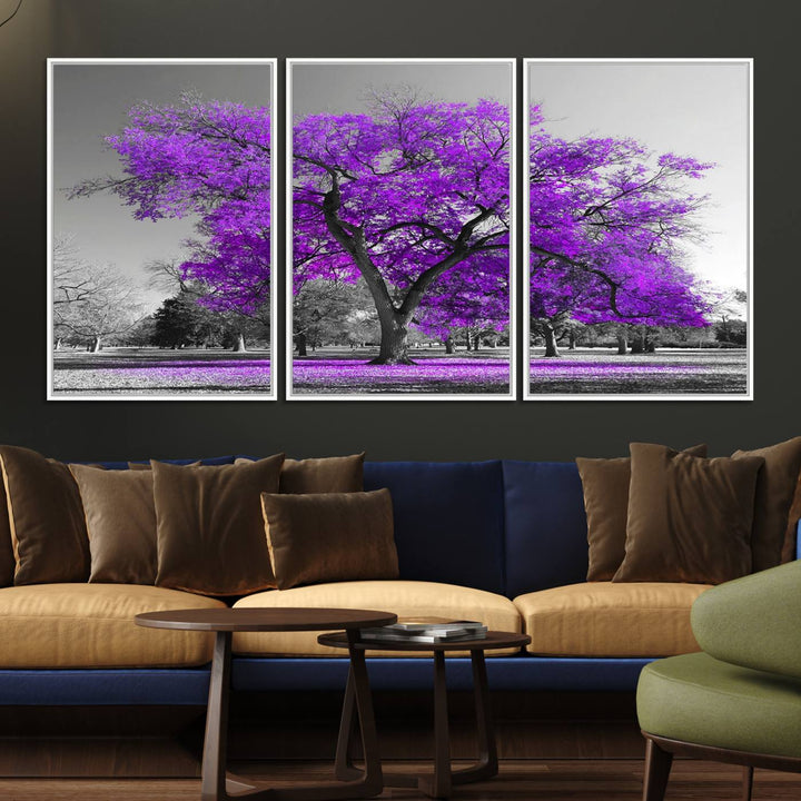 The Big Purple Tree Wall Art Canvas Print showcases a vibrant purple tree set against a black-and-white landscape.