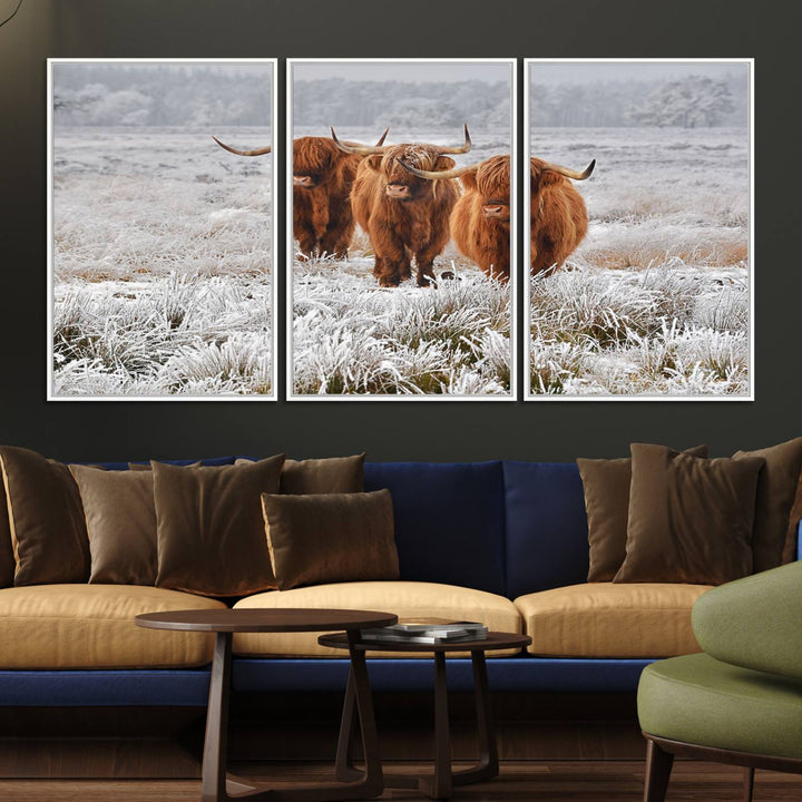 The Highland Cows in Snow canvas showcases three cattle in a frosty field.