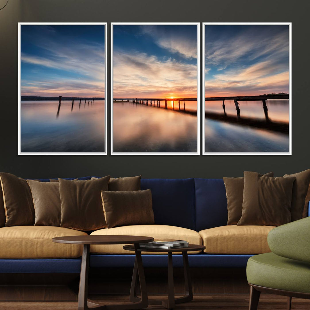 The Sunset Pier Canvas features a serene coastal landscape with vibrant hues under cloudy skies, ideal for modern decor.