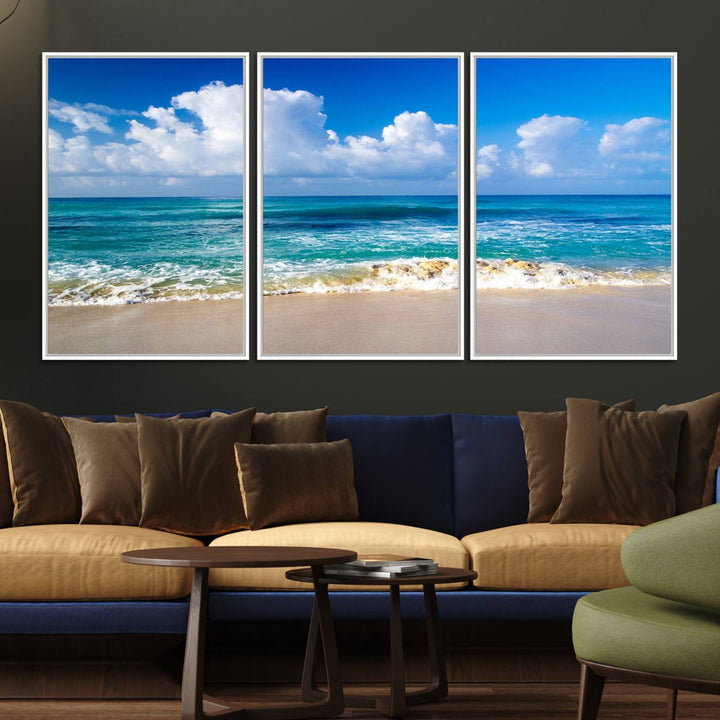 The Tropical Beach 3-Panel Canvas Wall Art features ocean waves gently lapping on a beach under blue skies, making it an ideal choice for coastal decor.