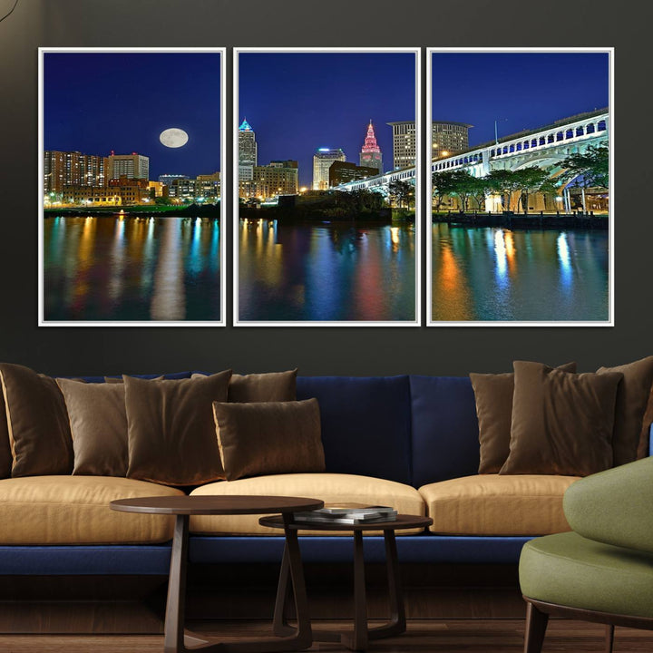 Cleveland City Lights Night Skyline Wall Art canvas showcases a moonlit cityscape reflected on water.