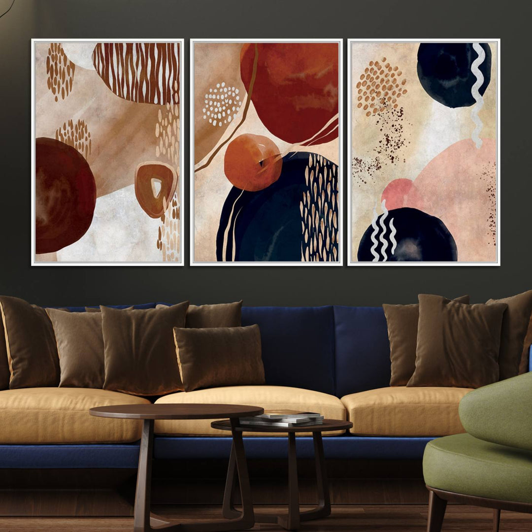 The Boho Neutral Canvas Print Set with earthy tones and circles hangs on the wall.