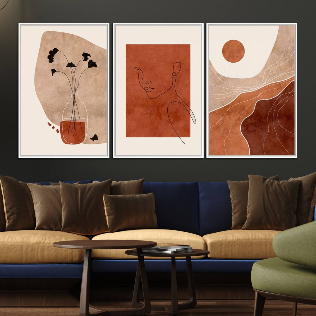 A giclée canvas triptych showcases minimalist mountain landscapes in earthy tones.