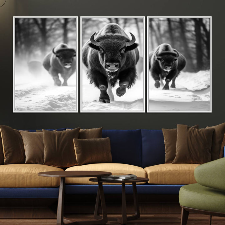 The Buffalo Wall Art Canvas Print of bison running through snow adorns the wall.