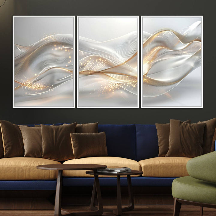 A modern living room is enhanced by the Abstract Art Grey and Gold Lines Wall Art, its elegant lines shimmering against a dark wall.